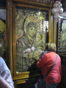 Religious icon that was kissed for blessing. Many people held shawls and paper to the icon to absorb the blessing.